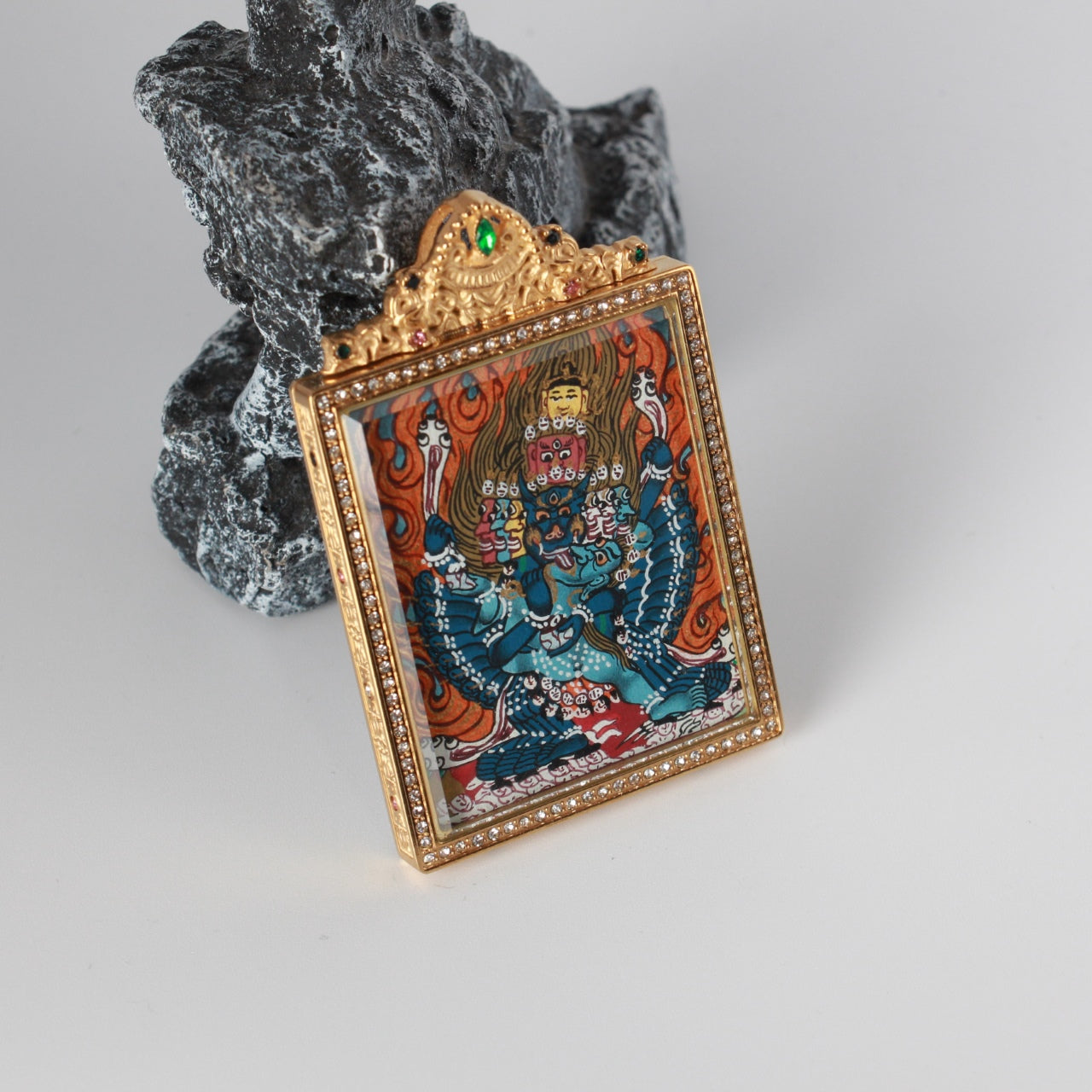 Detailed view of the titanium steel casing for the Yamantaka Thangka pendant, symbolizing protection and elegance in Tibetan Buddhist tradition.

