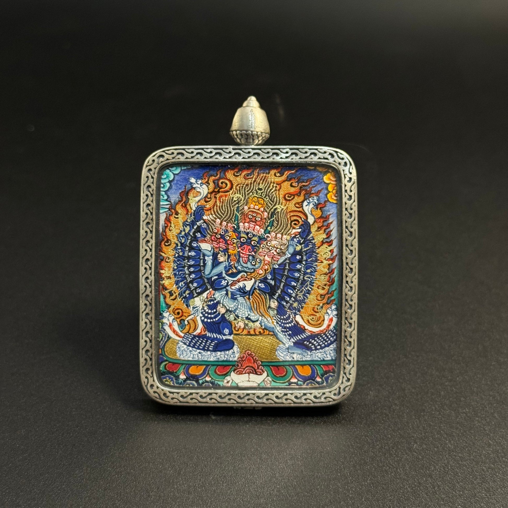  Detailed view of the presentation and casing for the Yamantaka Cuiying Thangka pendant.
