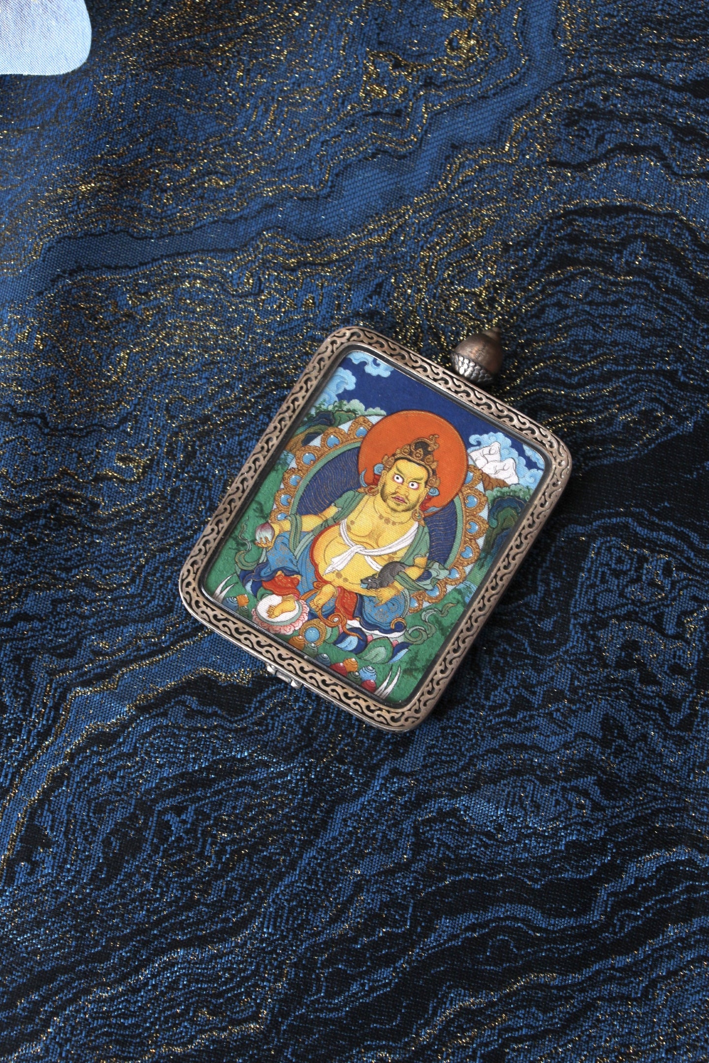 Tibetan Thangka of Yellow God of Wealth (Zangbala Sebo), 4x5cm, featuring mineral paint and a Dunhuang Nine Color Deer silver shell, made in Tibet.