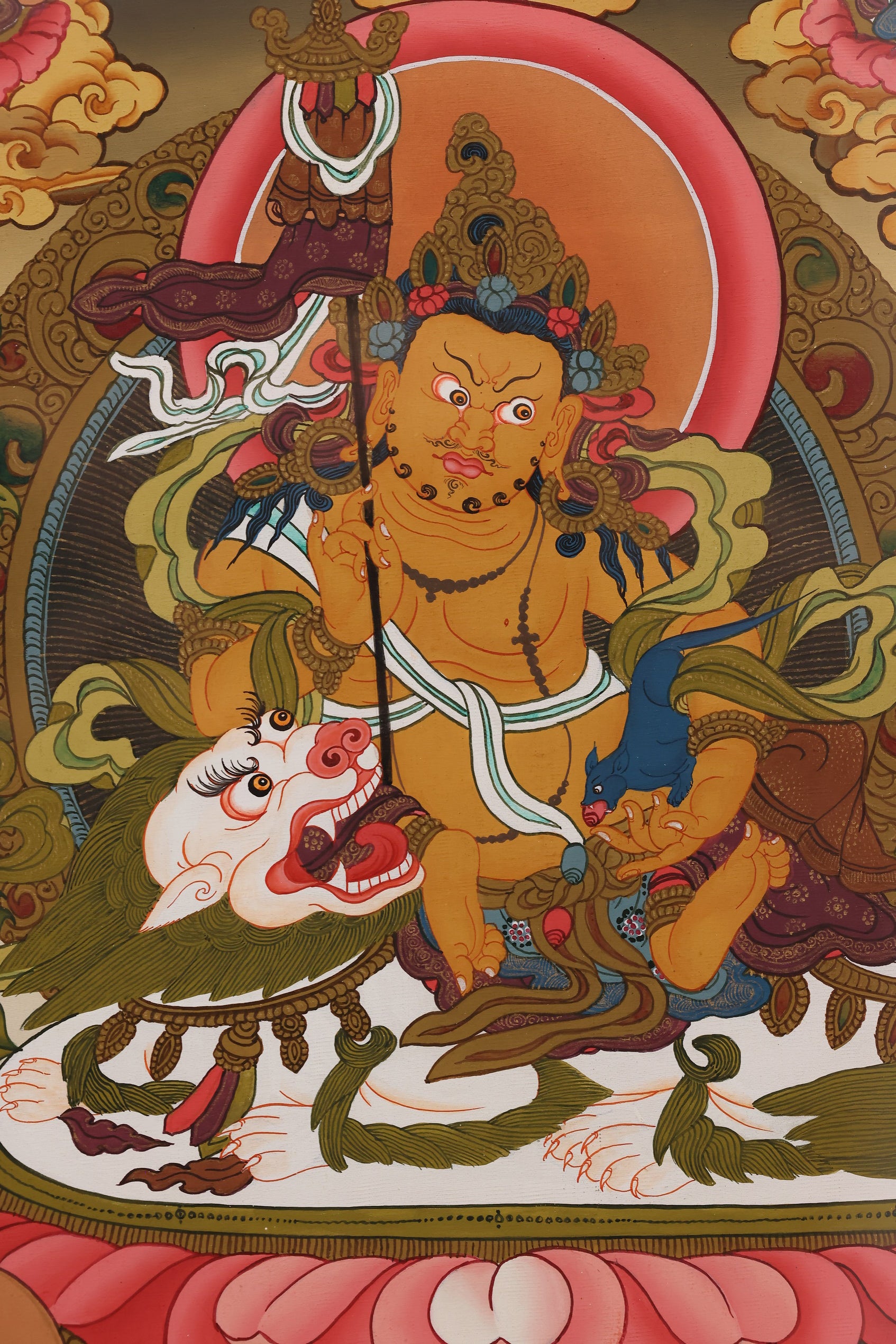 Yellow Jambhala Tibetan Buddhist thangka depicting the wealth deity as a symbol of prosperity and spiritual protection