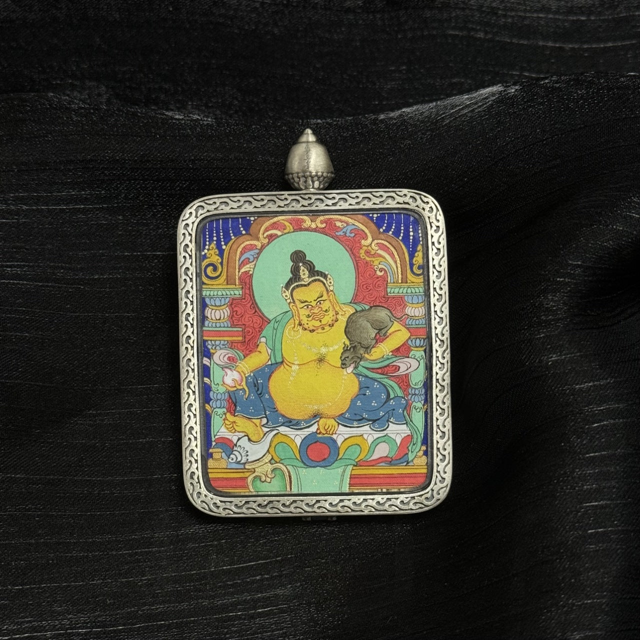  Close-up detail of the Chigung Yellow Jambhala Thangka painting showing intricate natural mineral pigment work and symbolic attributes, showcasing the artistry of Tibetan lineage painters.
