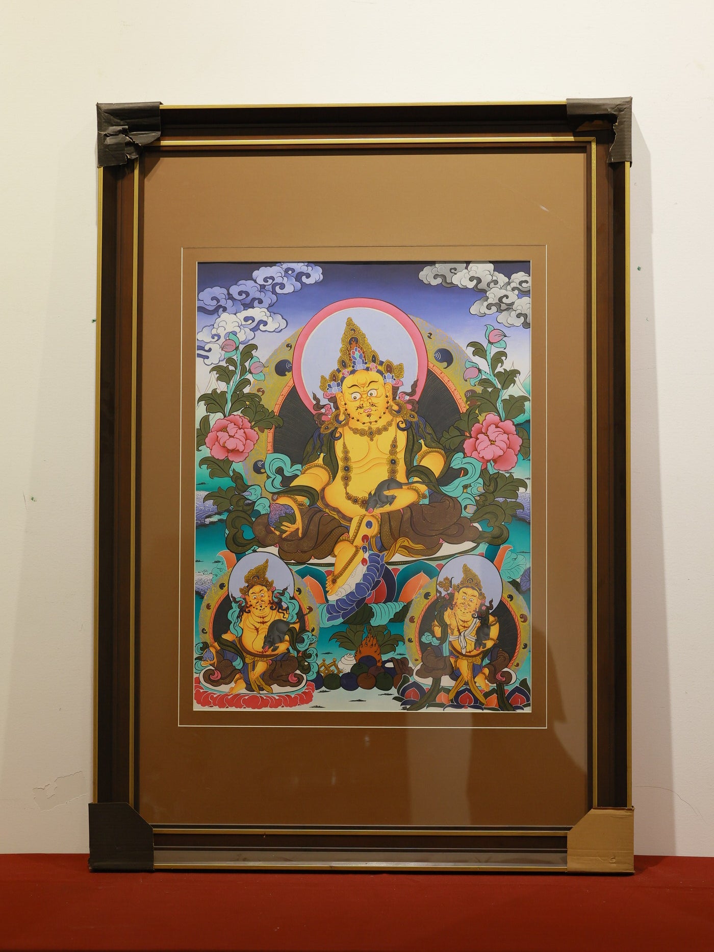 Yellow Jambhala thangka representing financial blessing, abundance, and compassionate generosity in Tibetan Buddhism