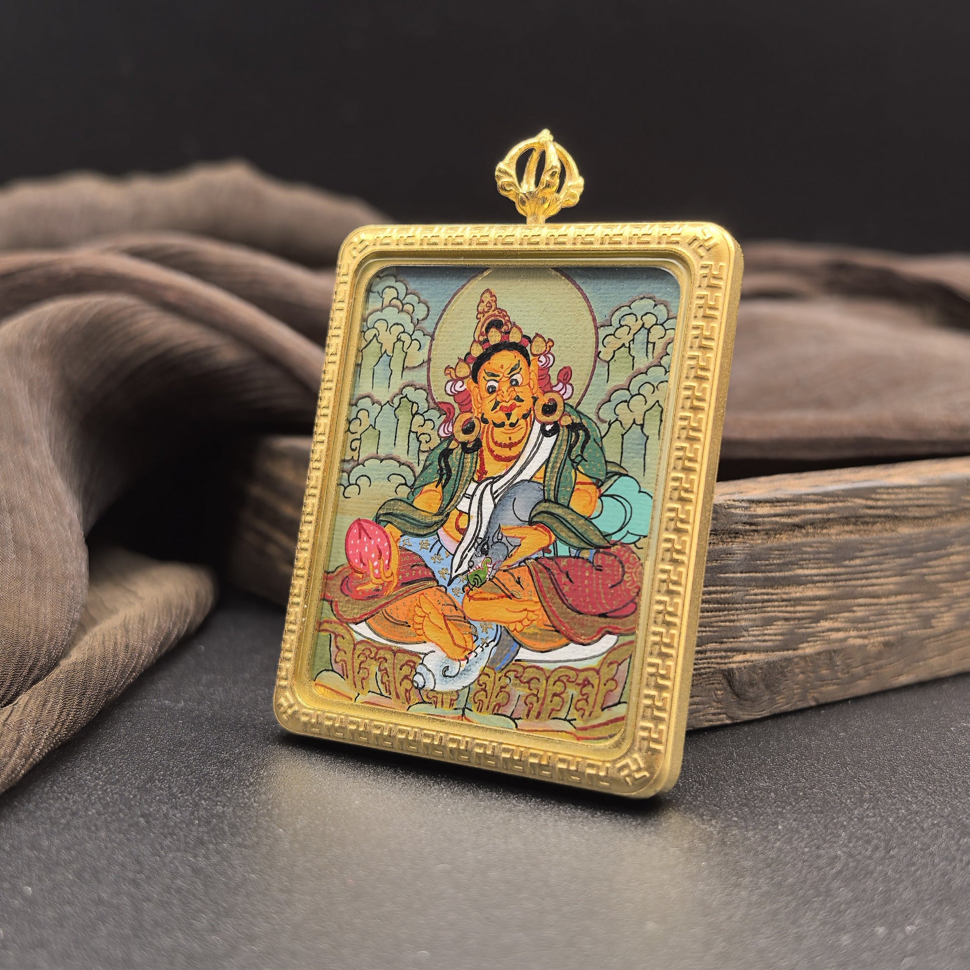  Hand-painted Nepal Yellow Jambhala (黄财神) Thangka pendant 4x5cm with titanium casing featuring the chief of wealth deities, representing prosperity and the bestowal of main wealth in Buddhist tradition.
