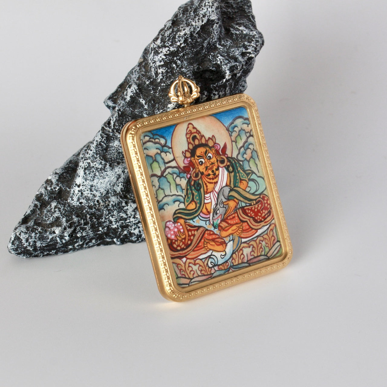 Hand-painted Nepal Elegant Gadri Yellow Jambhala Thangka pendant featuring the King of Wealth, encased in titanium steel, representing wealth and Dharma in Tibetan Buddhist tradition.
