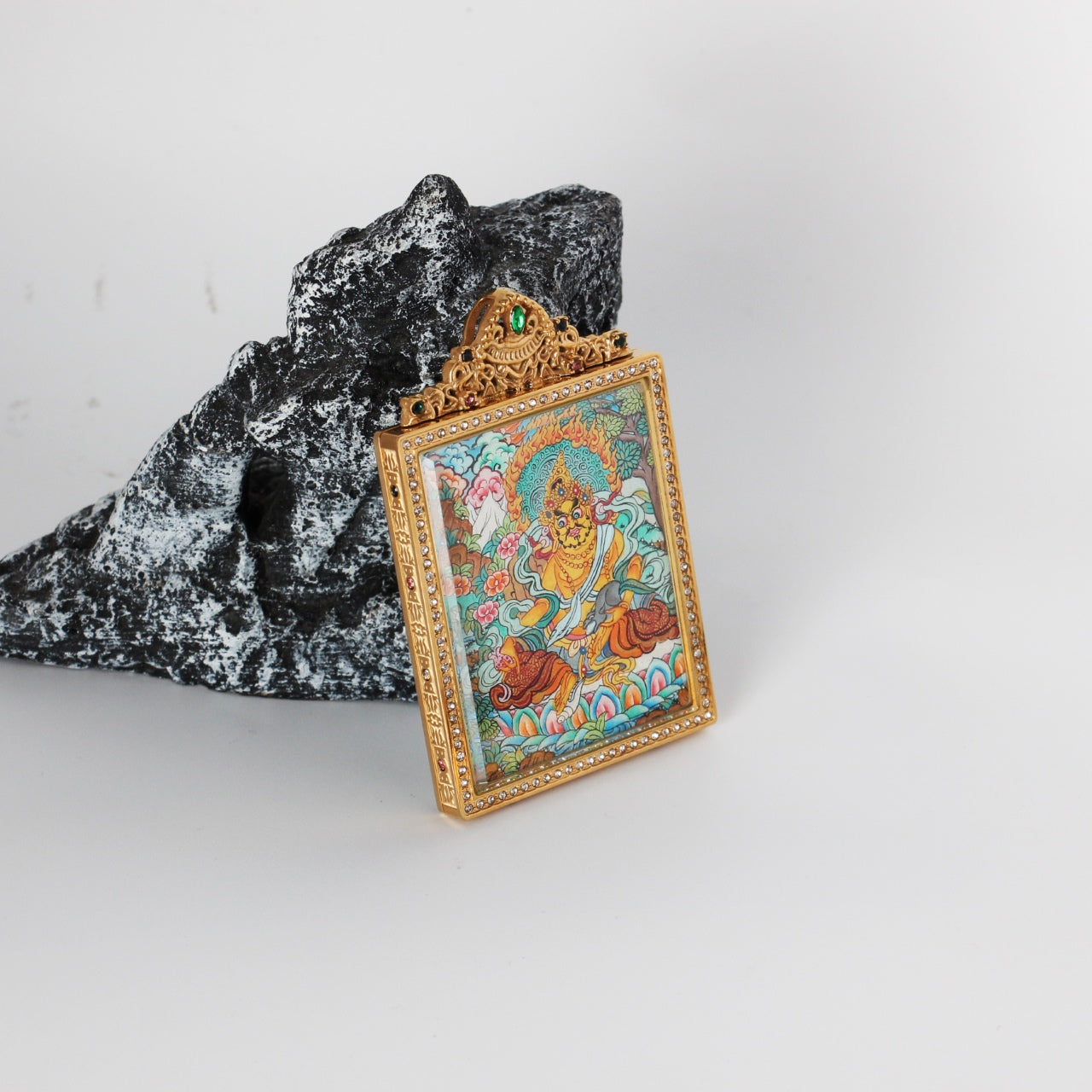 Hand-painted Nepal Premium Yellow Jambhala Thangka pendant featuring the Wealth Bestowing Deity, encased in titanium steel, representing wealth and prosperity in Tibetan Buddhist tradition.

