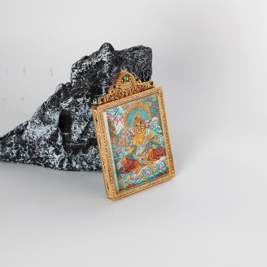 Hand-painted Nepal Premium Yellow Jambhala Thangka pendant featuring the Wealth Bestowing Deity, encased in titanium steel, representing wealth and prosperity in Tibetan Buddhist tradition.

