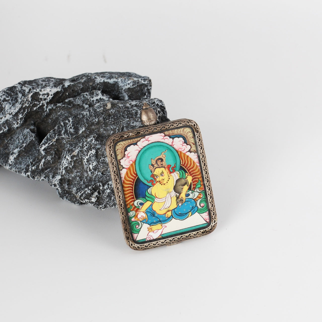  A 3.5x4.5cm hand-painted Rebgong Yellow Jambhala Thangka pendant featuring the Wealth Bestowing Deity, encased in titanium steel, representing wealth and prosperity in Tibetan Buddhist tradition.

