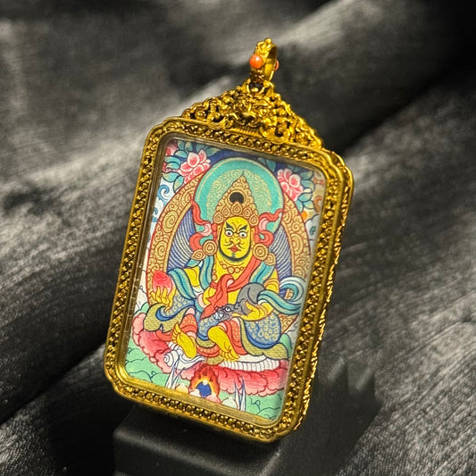  Close-up detail of the Rekong Yellow Jambhala Thangka painting showing natural mineral pigments, showcasing the masterful artistry of Rekong lineage painters.

