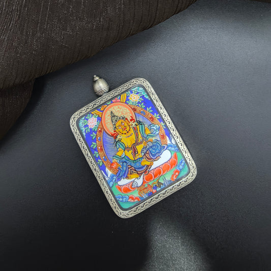 A 3.5x4.5cm hand-painted Rekong Yellow Jambhala (黄财神) Thangka pendant with 925 silver featuring the King of wealth deities, representing wealth and fortune in Buddhist tradition.
