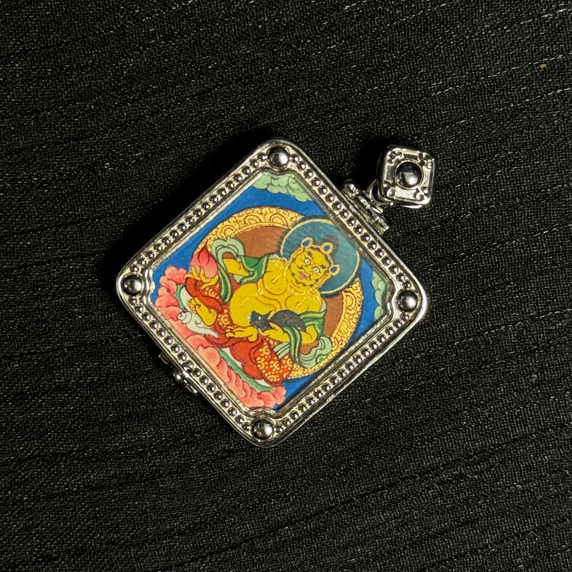  Close-up detail of the Rekong Yellow Jambhala Thangka painting showing natural mineral pigments, showcasing the masterful artistry of Rekong lama artists.