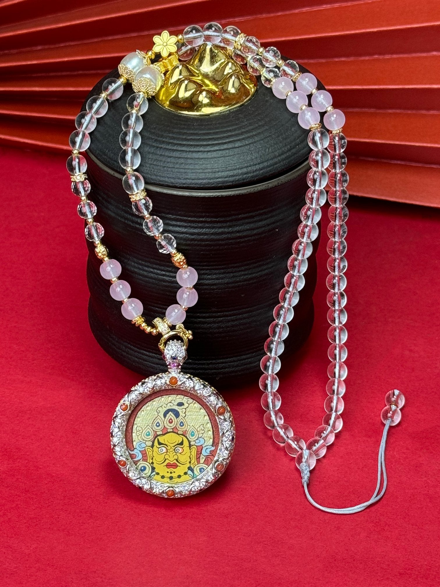 Hand-painted Rekong Red Gold Yellow Jambhala (黄财神) Thangka pendant 3.5cm with copper casing featuring the king of wealth deities, representing prosperity in Buddhist tradition.
