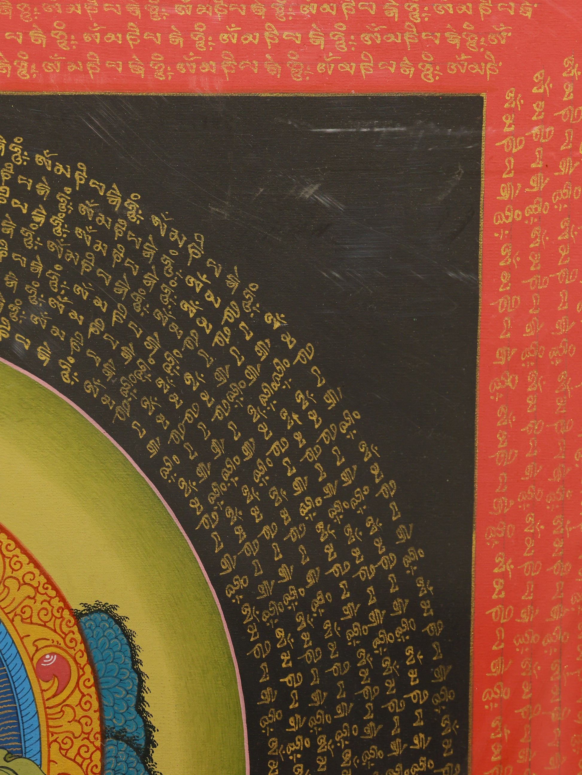 Tibetan Thangka of Yellow Jambhala with Six Syllable Mantra, detailed sacred painting symbolizing wealth and abundance.