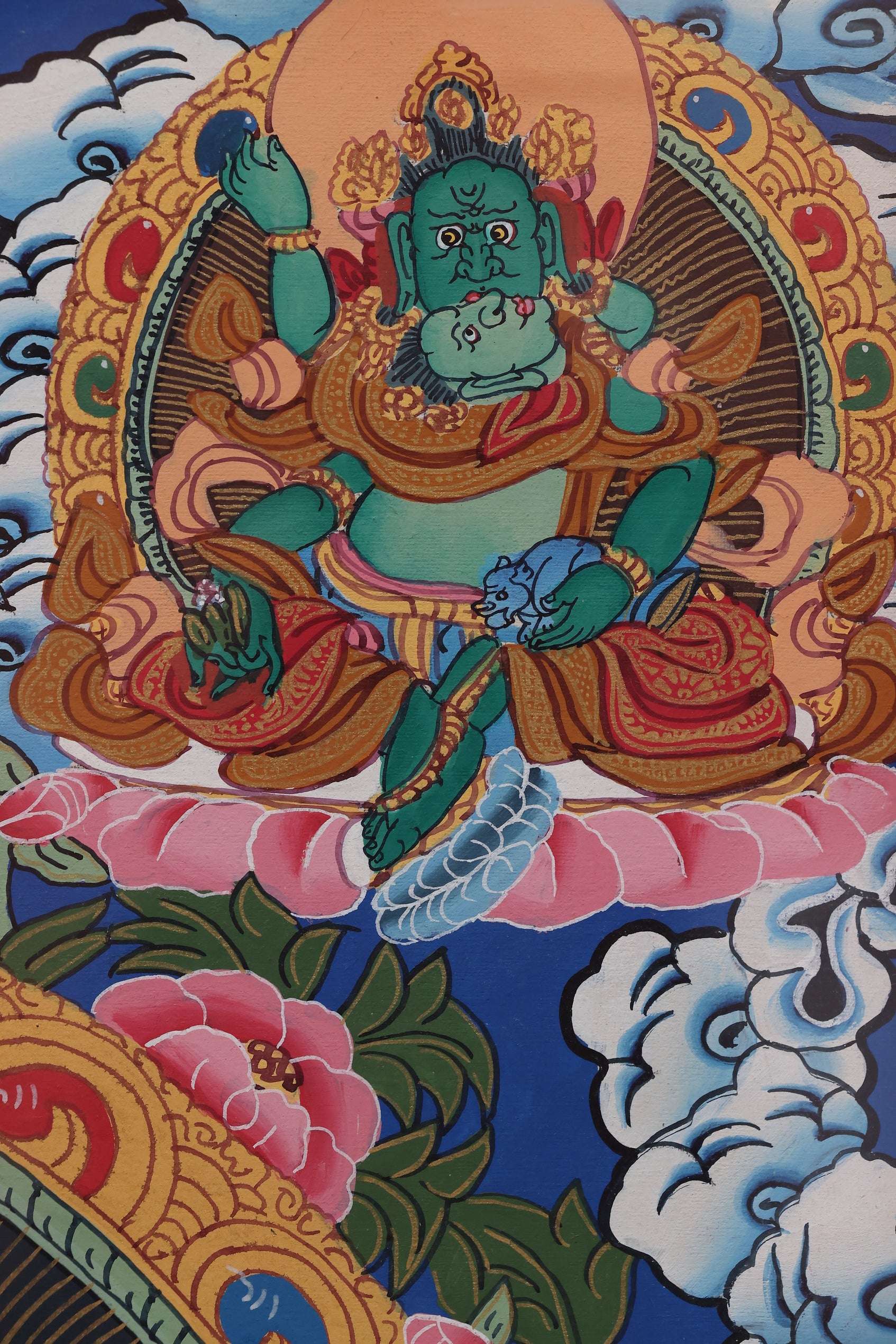 Yellow Jambhala performing prosperity rituals, depicted in traditional Tibetan art style.