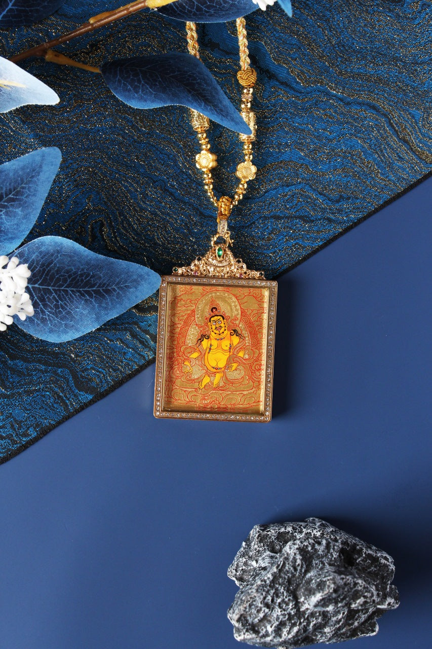 Close-up detail of the Tibetan Buddhist Yellow Jambhala Thangka painting showing intricate natural mineral pigment work and gold-accented ornaments, showcasing the masterful artistry of Tibetan lineage painters.

