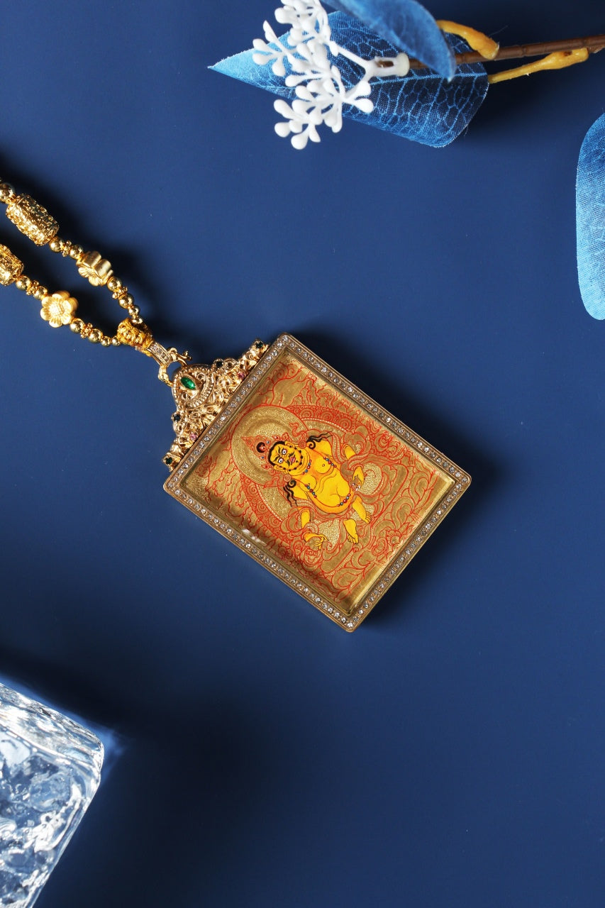 Detailed view of the exclusive 925 Sterling Silver casing for the Yellow Jambhala Thangka pendant, symbolizing protection and elegance in Tibetan Buddhist tradition.

