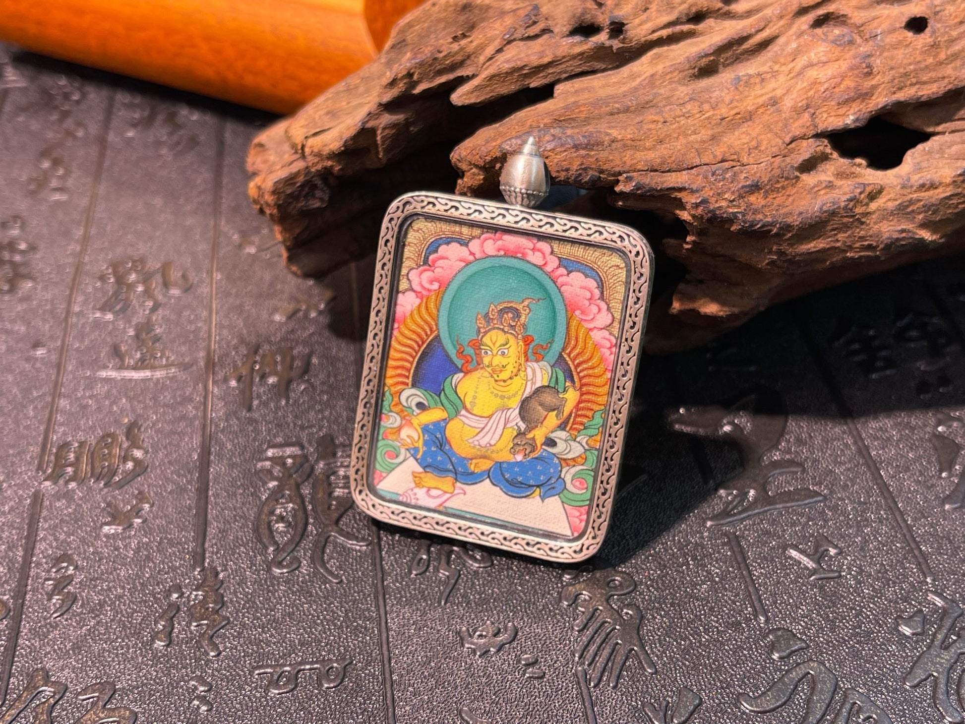 Hand-painted Tibet Yellow Jambhala (黄财神) Thangka pendant 3.5x4.5cm with Dunhuang Nine-Color Deer silver casing featuring wealth and abundance, representing liberation from poverty in Buddhist tradition.
