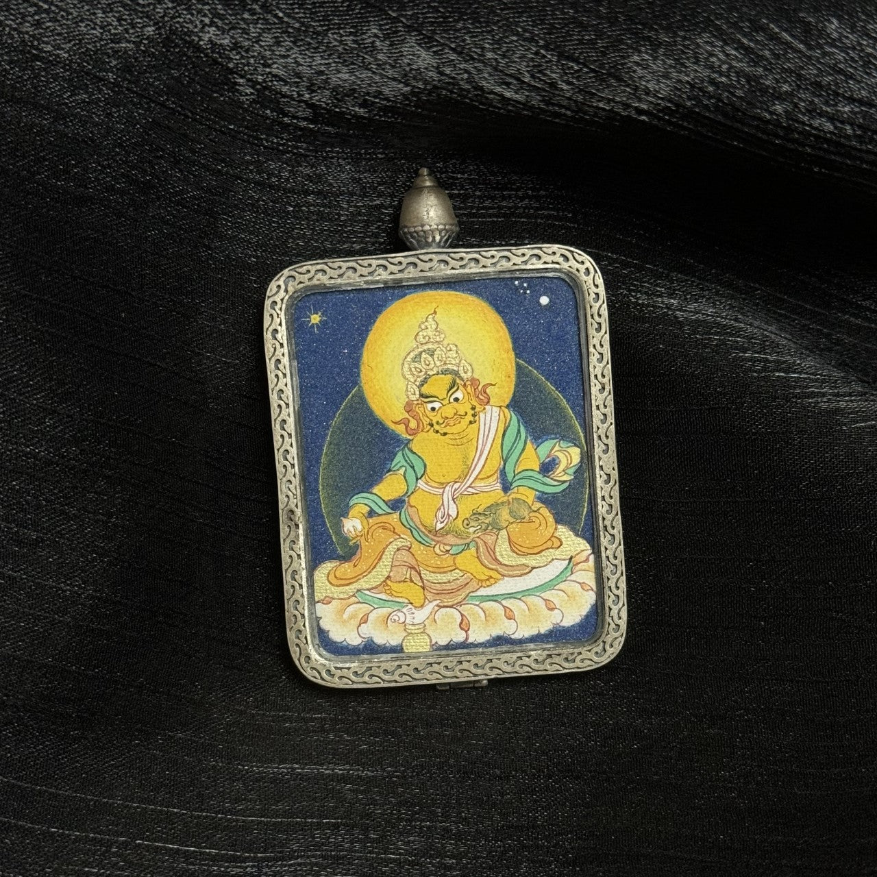  Hand-painted Tibet Coarse Yellow Jambhala Thangka pendant featuring the King of Wealth, encased in Dunhuang Nine-Colour Deer silver, representing merit and abundance in Tibetan Buddhist tradition.
