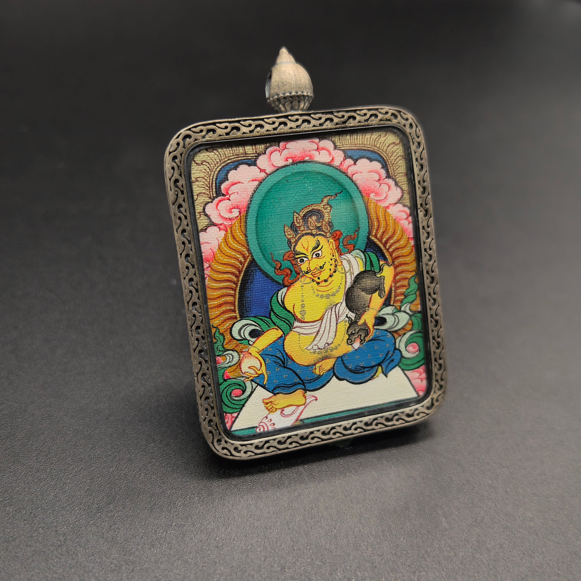  A 3.5x4.5cm hand-painted Tibet Red Cloud Yellow Jambhala (黄财神瞻巴拉) Thangka pendant with 925 silver featuring the king of wealth deities, representing wealth and prosperity in Buddhist tradition.

