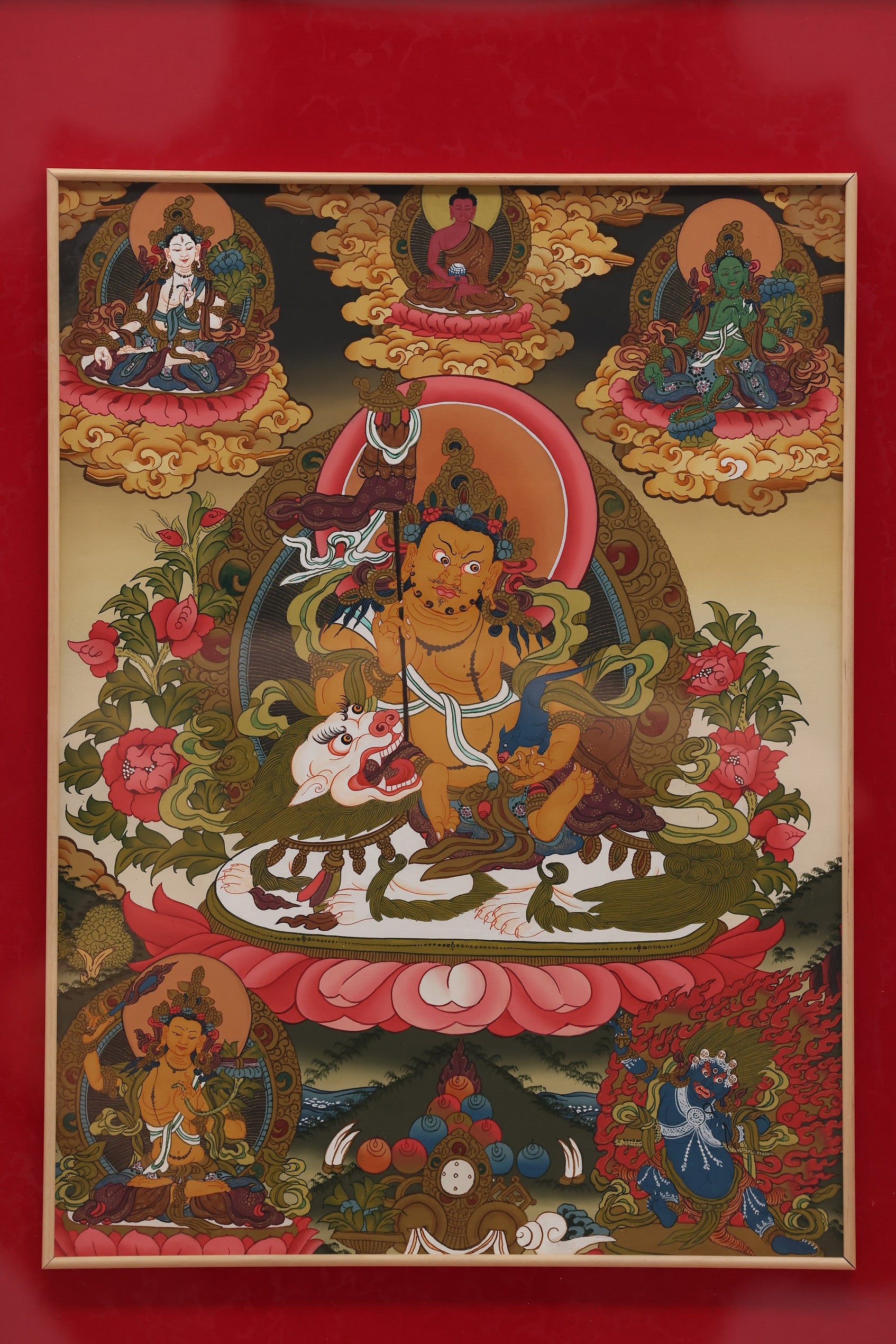 Hand-painted Tibetan Yellow Jambhala thangka created according to traditional Buddhist iconography