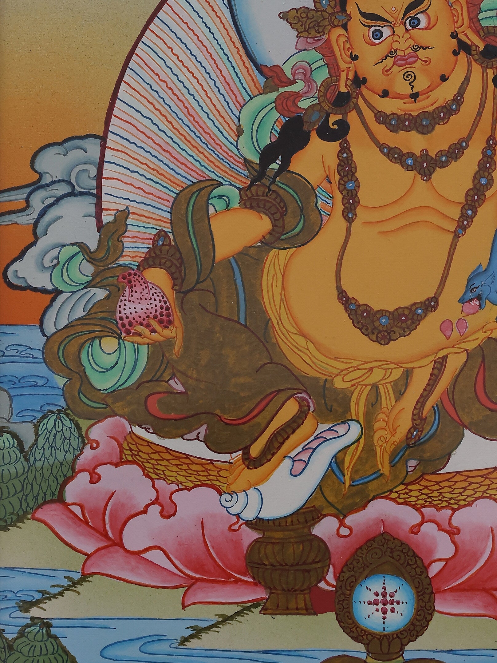 Tibetan Buddhist wealth deity Yellow Jambhala depicted in a colorful traditional thangka painting.