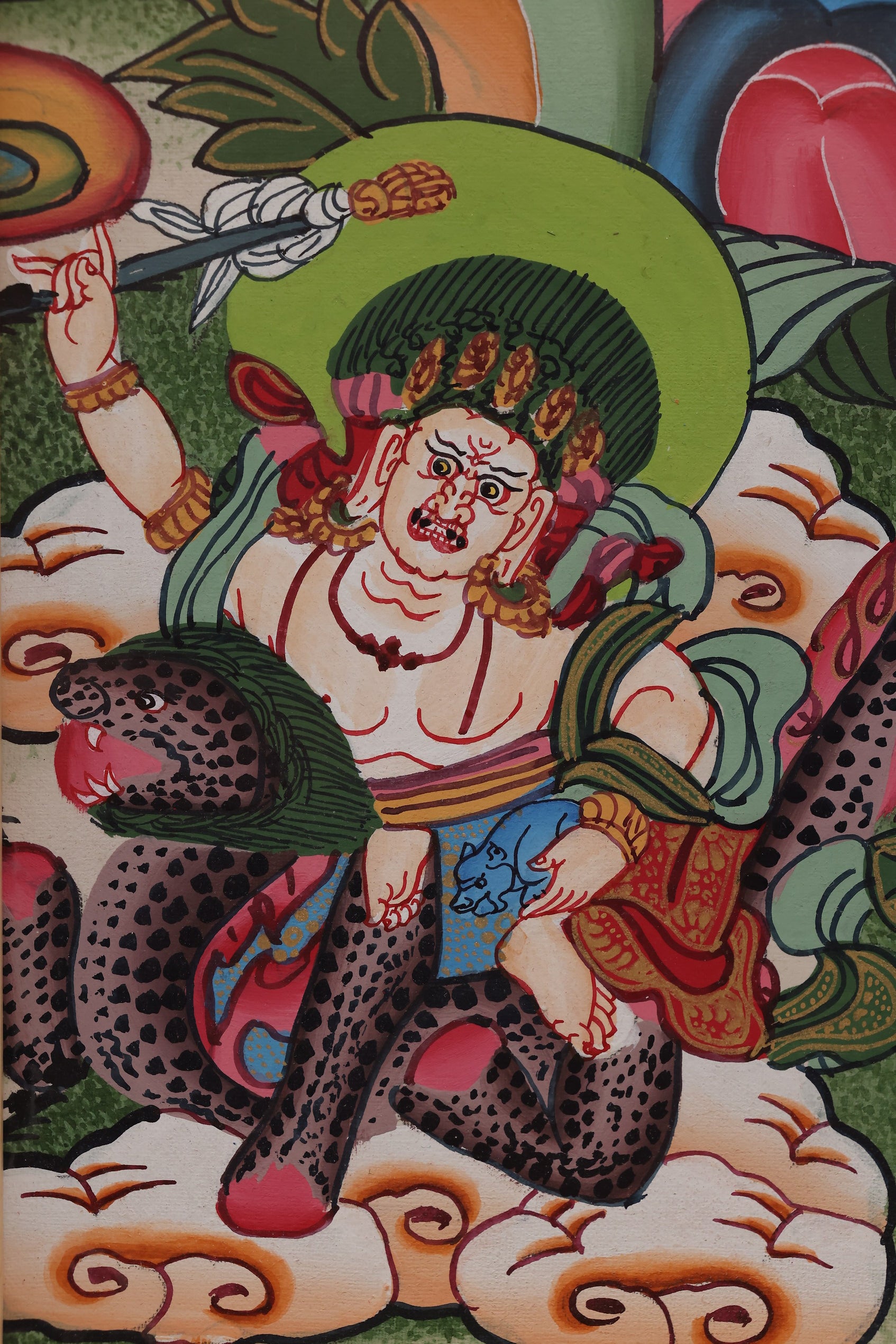 Yellow Jambhala carrying a treasure bag, symbolizing generosity and wealth.