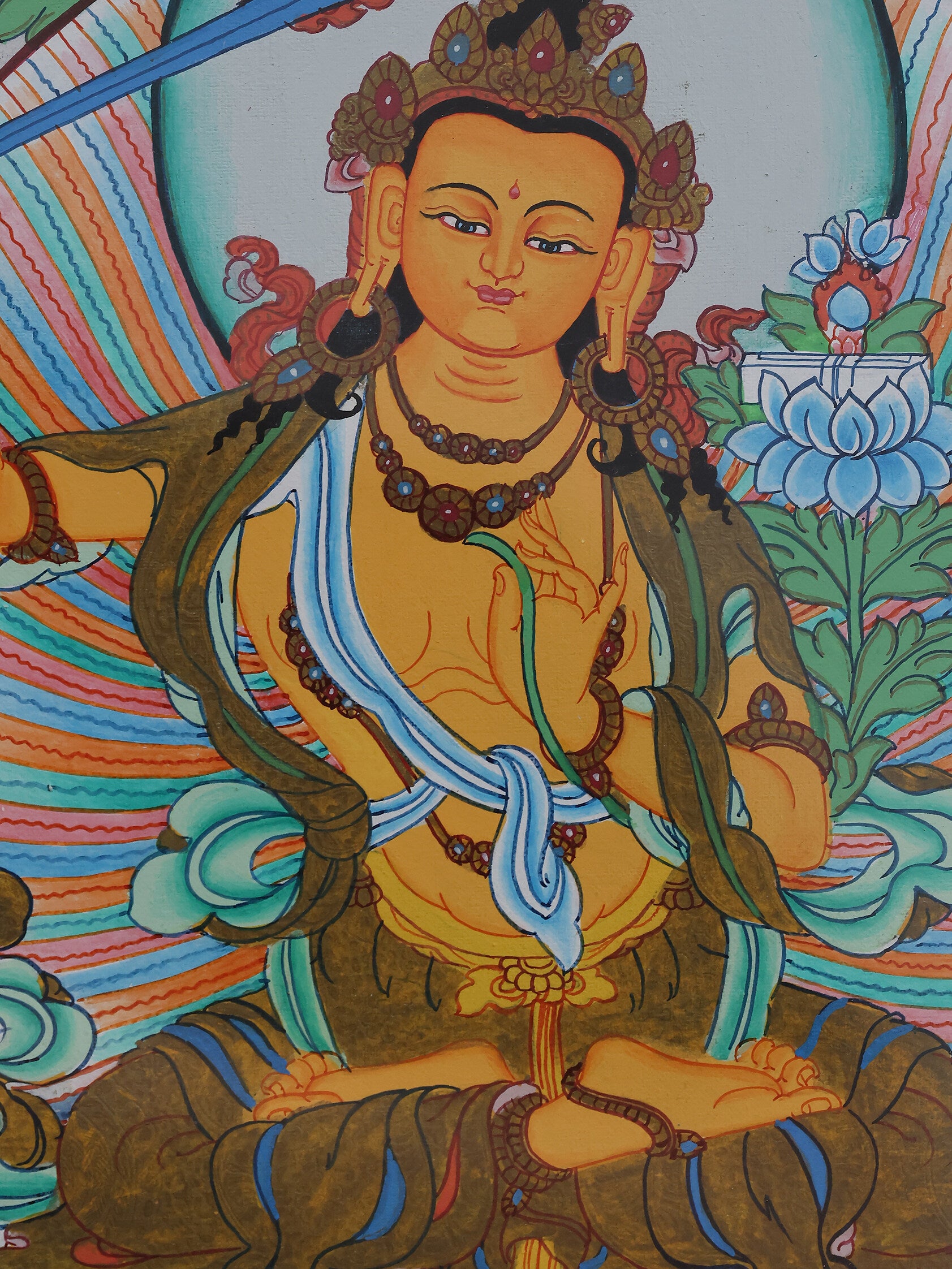 Golden Manjushri Bodhisattva thangka representing supreme wisdom in Tibetan Buddhism