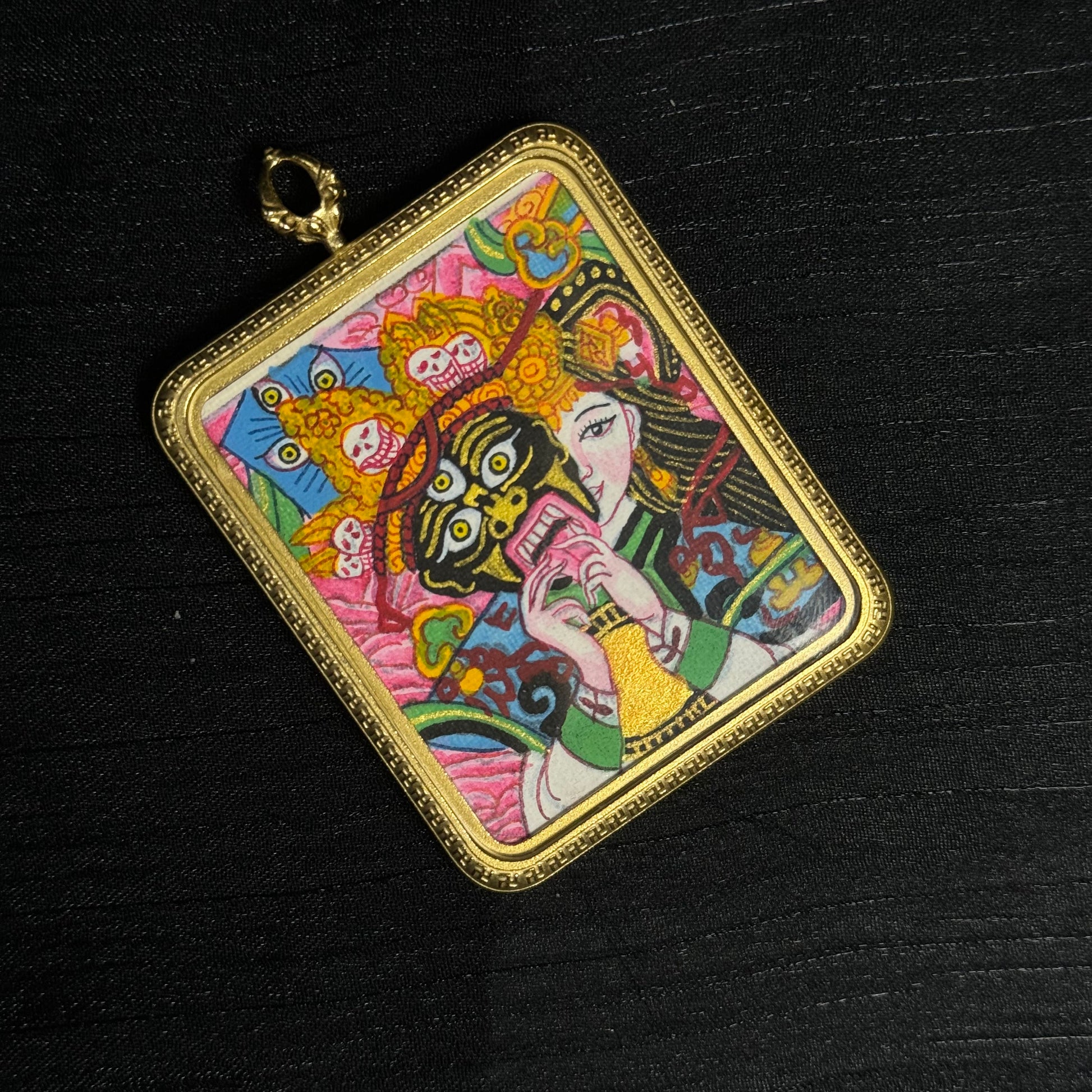 A 4x5cm hand-painted Nepal Pink Zaki Lhamo Thangka pendant featuring the female wealth deity in a pink palette, representing wealth and blessing in Buddhist tradition.
