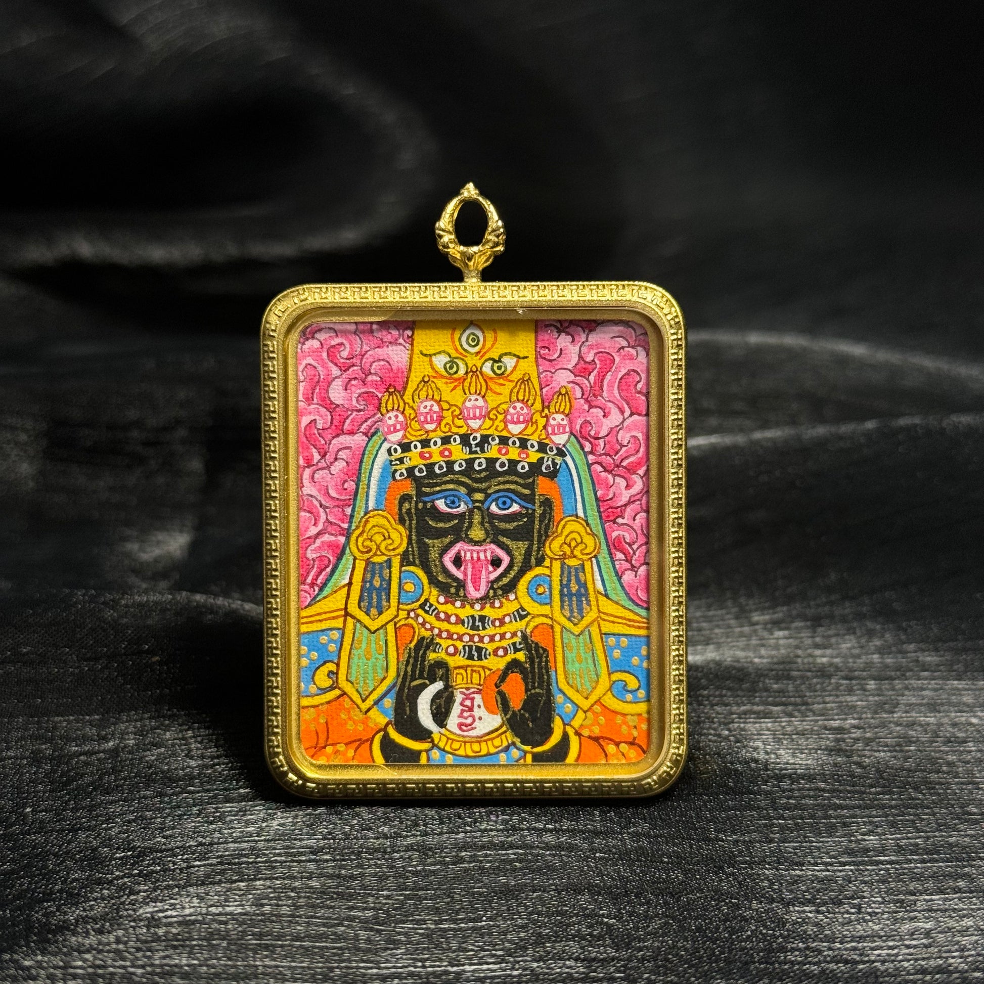Close-up detail of the Nepal Pink Zaki Lhamo Thangka painting showing hand-painted expression and pink palette.

