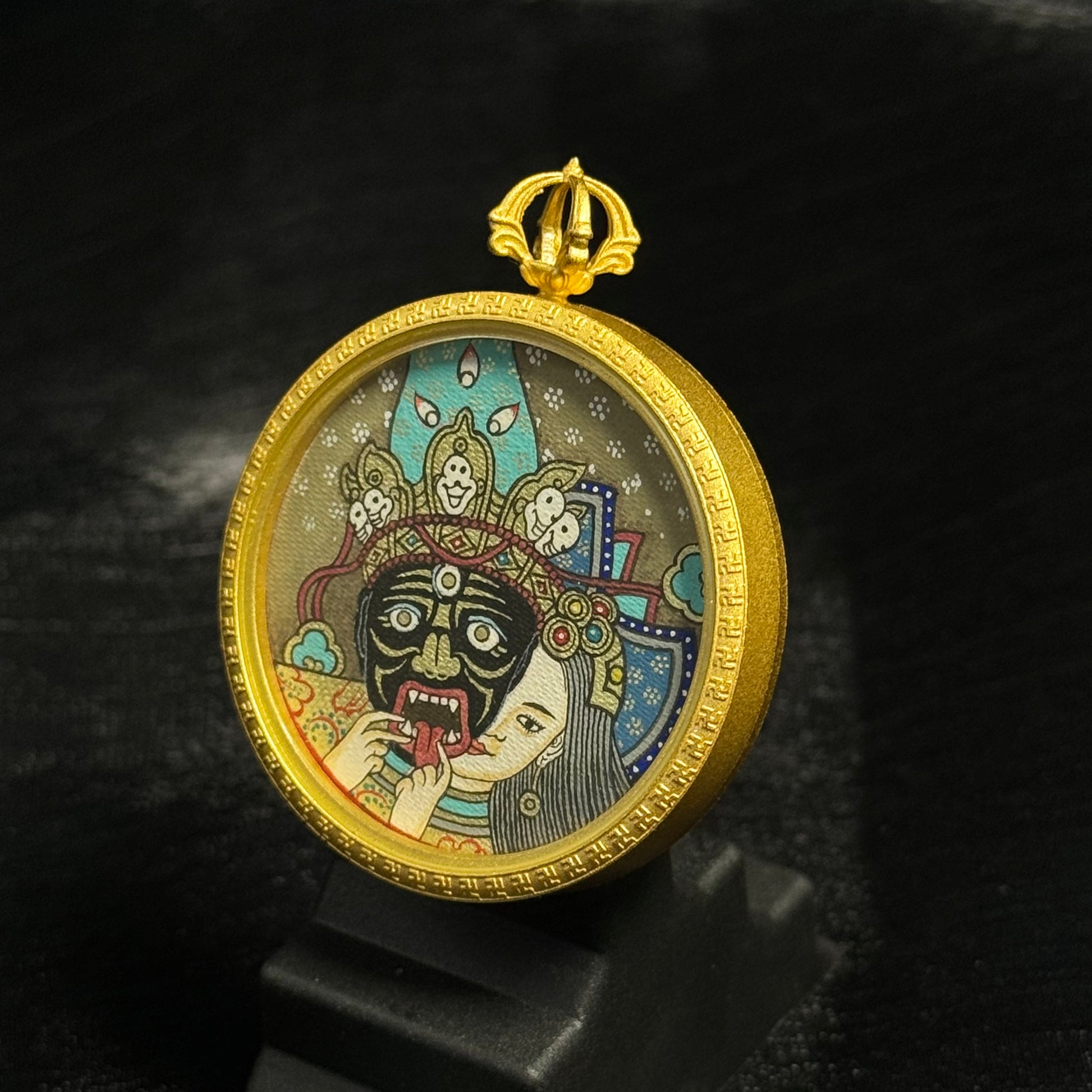  The Rekong Zaki Lhamo Past Life Thangka pendant displayed as a sacred amulet for wealth and blessing, embodying Buddhist tradition.
