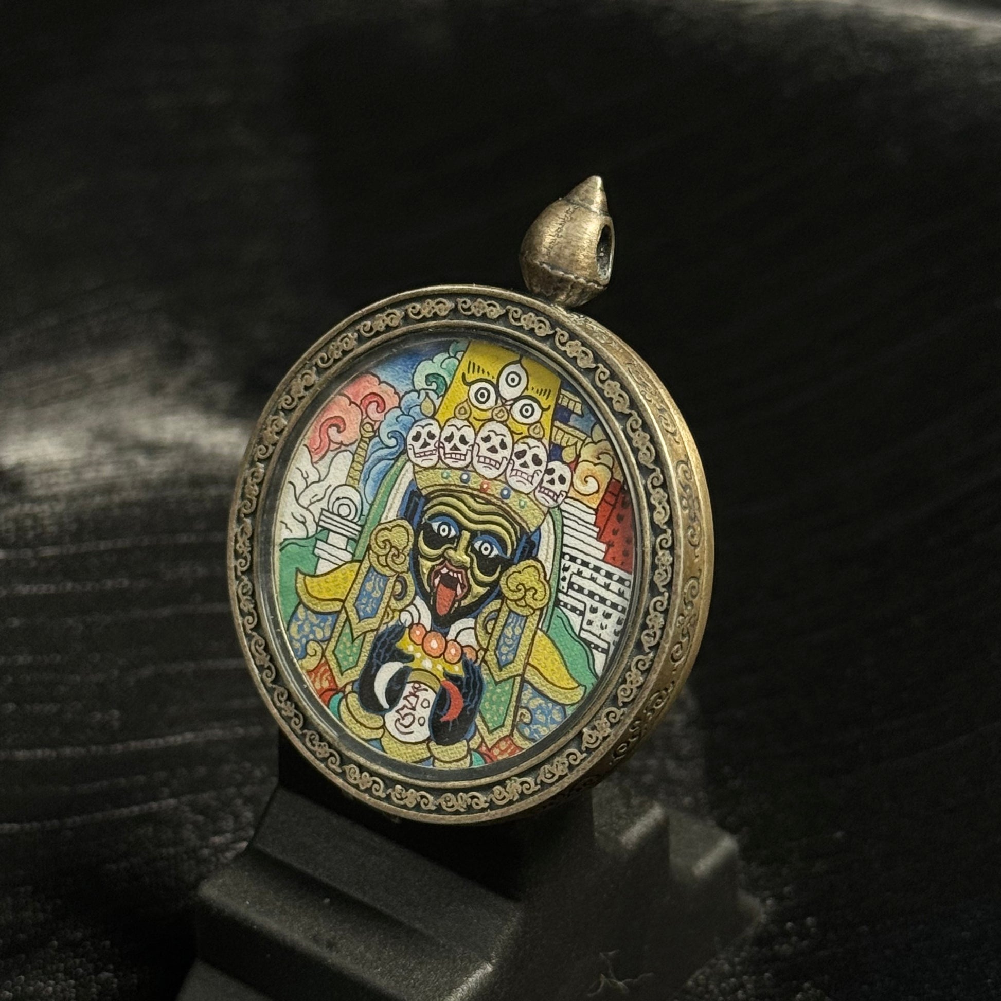 Close-up detail of the Rekong Zaki Lhamo with Potala Palace Thangka painting showing natural mineral pigments and gold, showcasing the masterful artistry of Rekong lineage painters.
