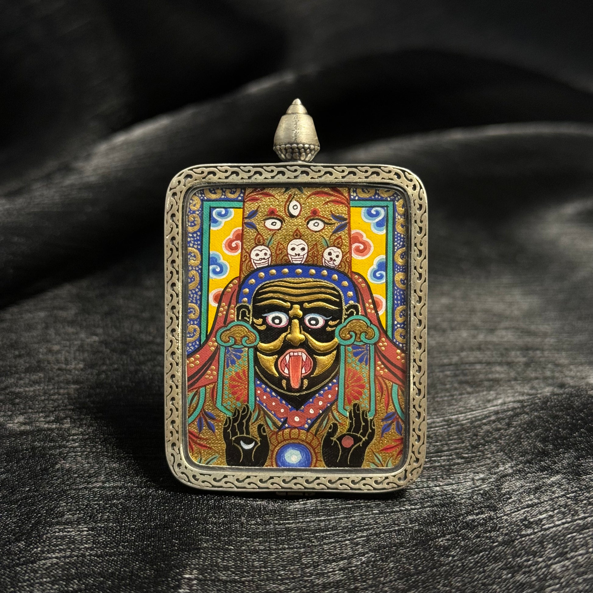 Close-up detail of the Rekong Zaki Lhamo Gold Relief Thangka painting showing multi-layer gold relief and natural mineral pigments.
