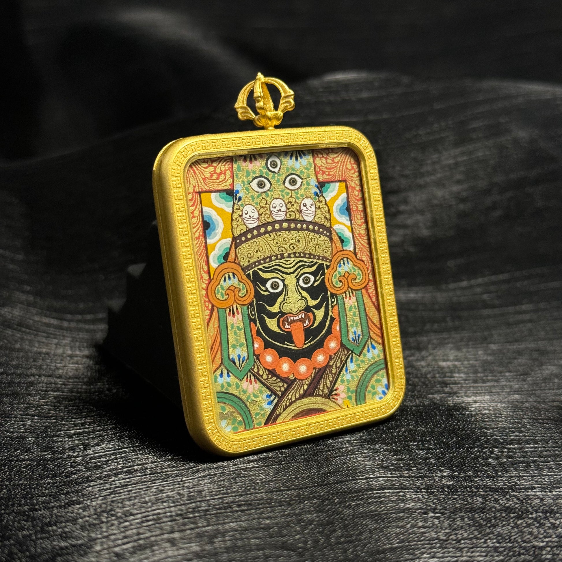  Close-up detail of the Rekong Zaki Lhamo Thangka painting showing natural mineral pigments and gold, showcasing the masterful artistry of Rekong lineage painters.
