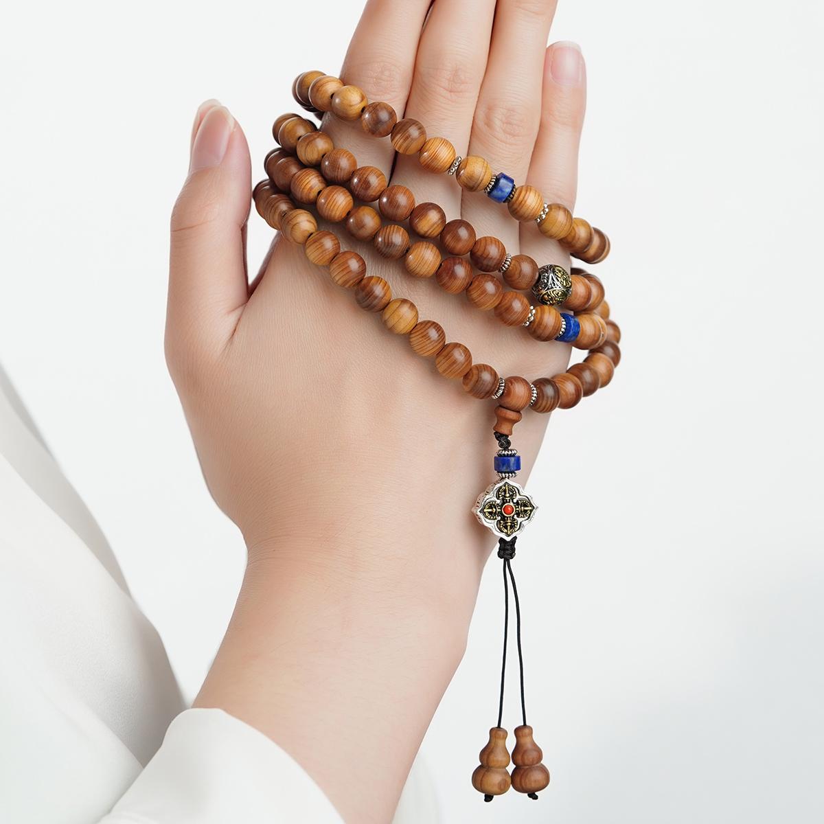 Artisan cypress wood prayer beads designed for mindfulness, chanting, and Tibetan spiritual traditions.