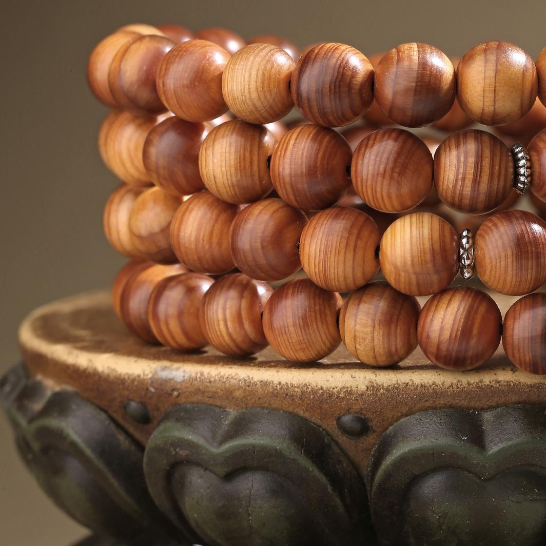 Handmade mala with cypress wood, lapis lazuli, and brass fittings for clarity and wisdom.