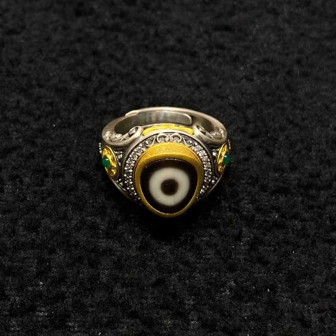 S925 sterling silver Dharma Wheel ring featuring detailed Tibetan Buddhist craftsmanship and smooth patina.