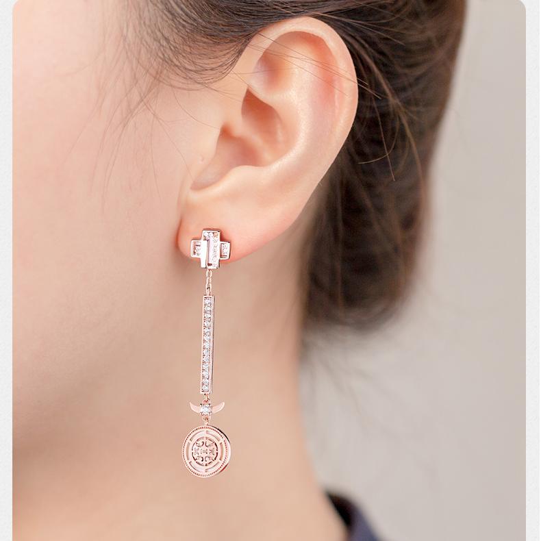 Handmade Tibetan dragon earrings representing auspicious energy and spiritual blessings.