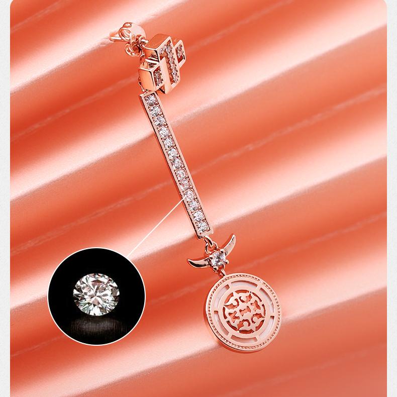 Tibetan Buddhist art-inspired dragon fortune earrings with silver alloy and sparkling zirconia.