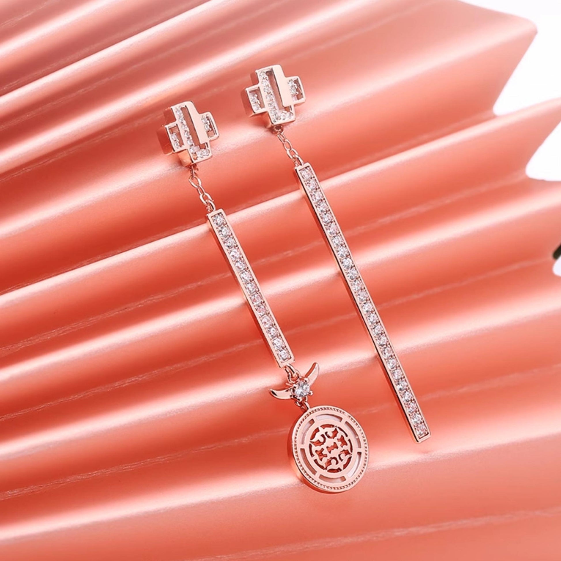 Tibetan Buddhist dragon earrings with mother of pearl inlay and zircon stones for protection and prosperity.