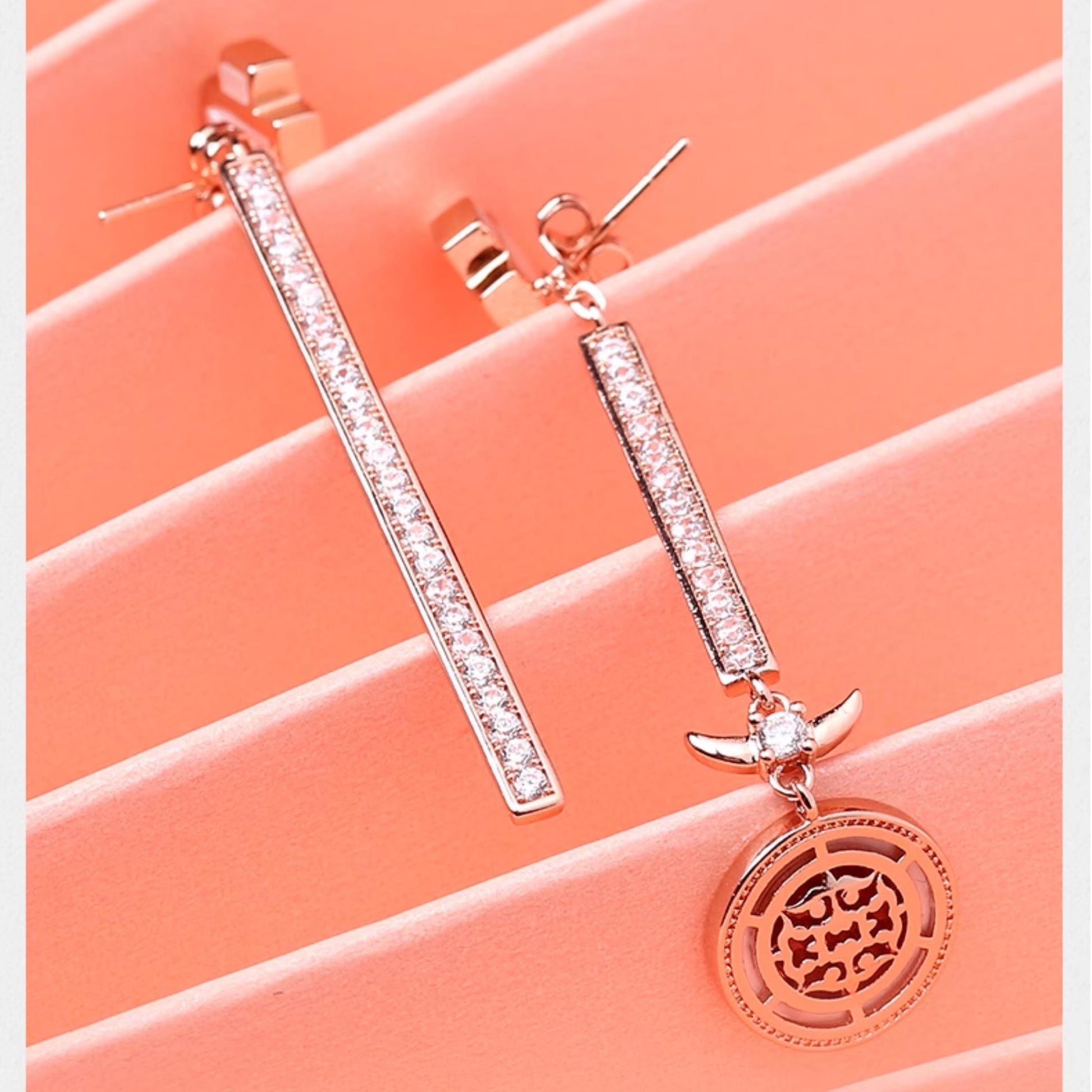 Handcrafted Tibetan dragon earrings with mother of pearl inlay and zircon details for good luck.