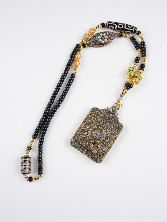 Miniature Tibetan Thangka of Dzambhala, hand-painted with mineral pigments to attract wealth and remove obstacles.