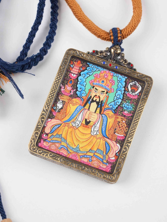 Tibetan Buddhist Gau box pendant featuring Dzambhala, the deity of fortune and abundance.