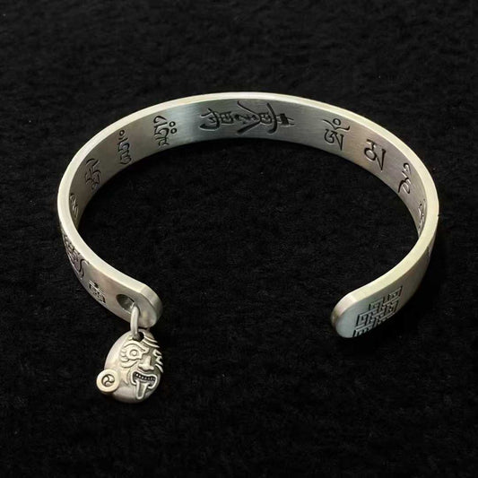 Sterling silver bracelet featuring the Eight Auspicious Symbols with fine inlay craftsmanship.