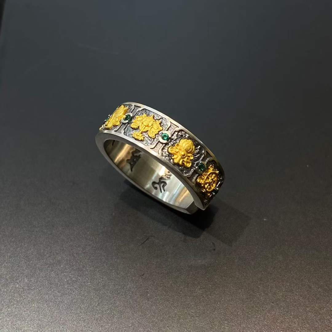 Close-up of a handcrafted 925 silver ring showcasing detailed Tibetan Buddhist sacred symbols.