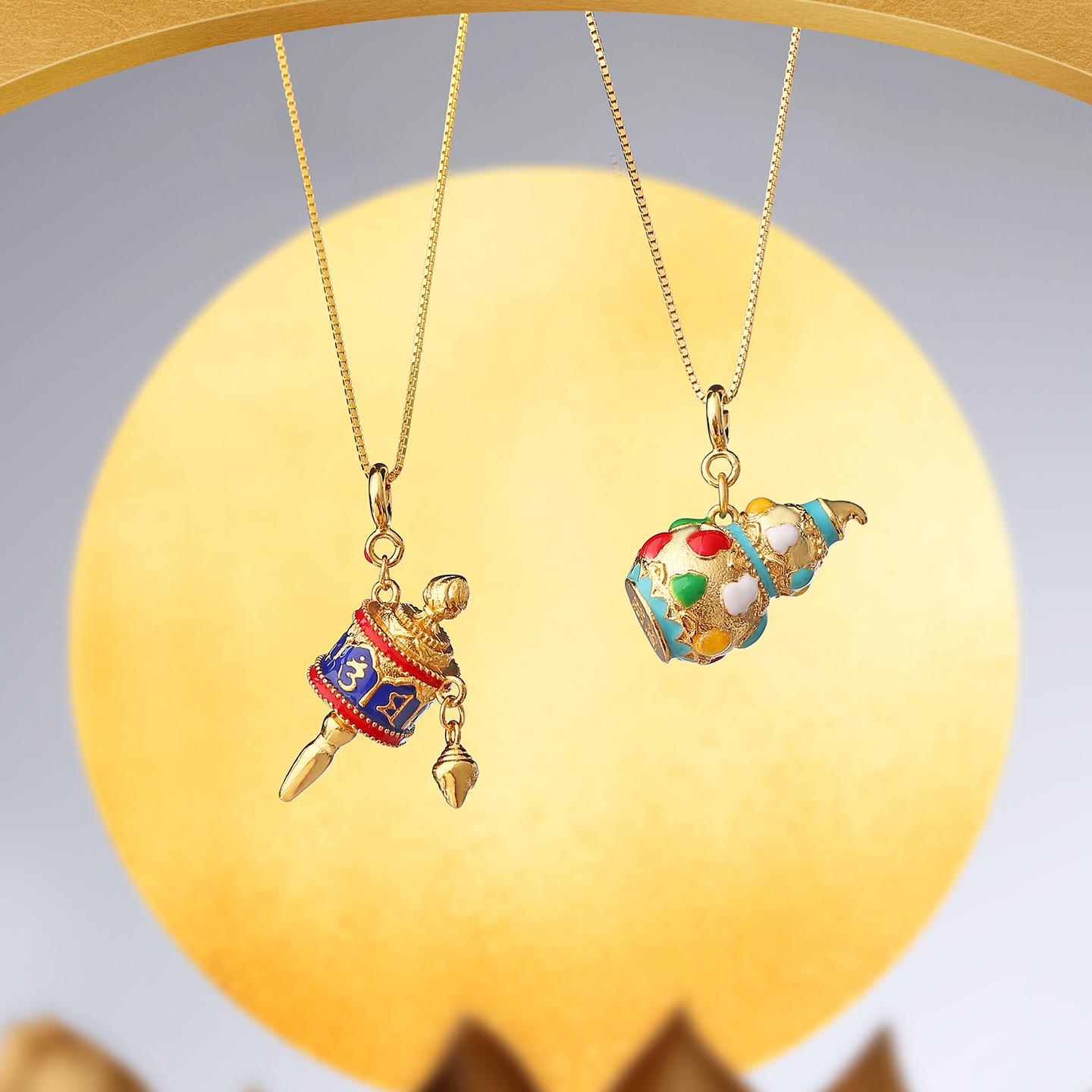 Handcrafted Tibetan Buddhist enamel gourd pendant symbolizing blessings.