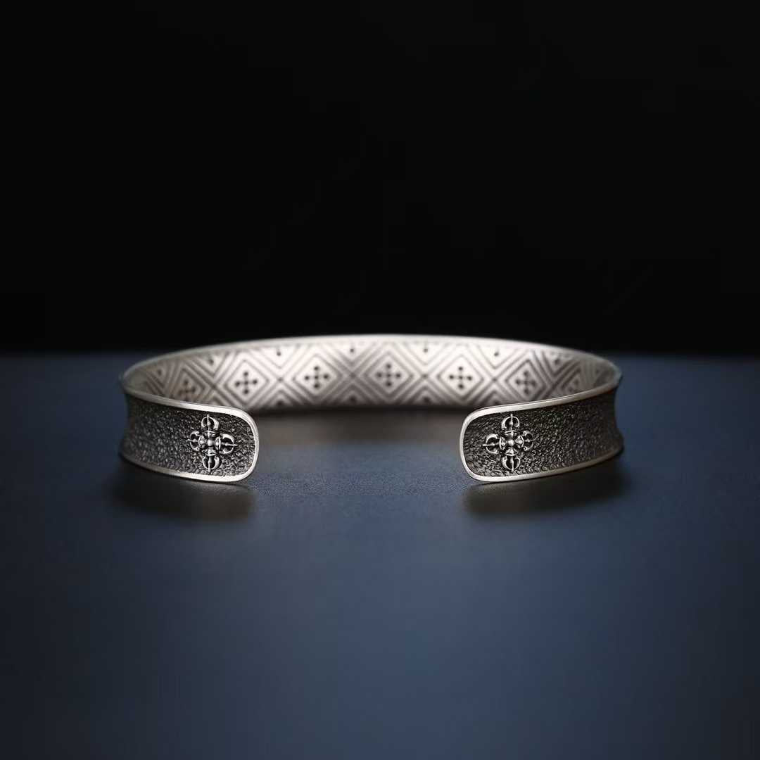 Tibetan Buddhist Everest bracelet, gold and silver inlaid, sacred symbol of spiritual power.