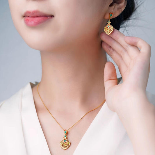 Fanjing Fenghua 925 silver earrings crafted with peacock feather design and Tibetan spiritual aesthetics.