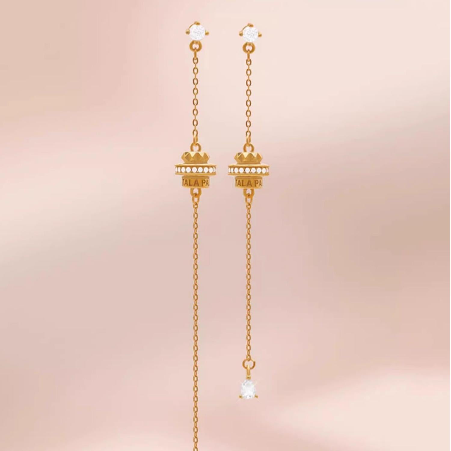 "Tibetan Buddhist Fu Lai Yun Zhuan earrings with 925 silver, 18K gold, and zircon, representing spiritual harmony and fortune."