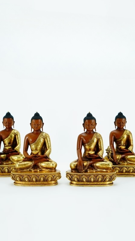 Alt text: A gilded Buddha statue, adorned with mineral pigment decorations, handcrafted with intricate details that showcase the unique charm of Tibetan Buddhist art, making it an ideal piece for Buddhist culture art lovers.