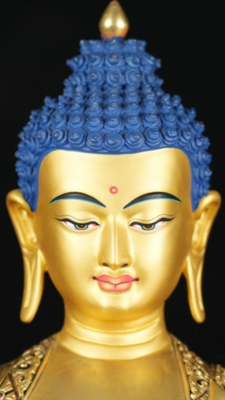 Gilded Tibetan Buddhist Buddha statue made from purple copper and painted with mineral pigments. A finely crafted spiritual art piece that enhances peace and enlightenment.