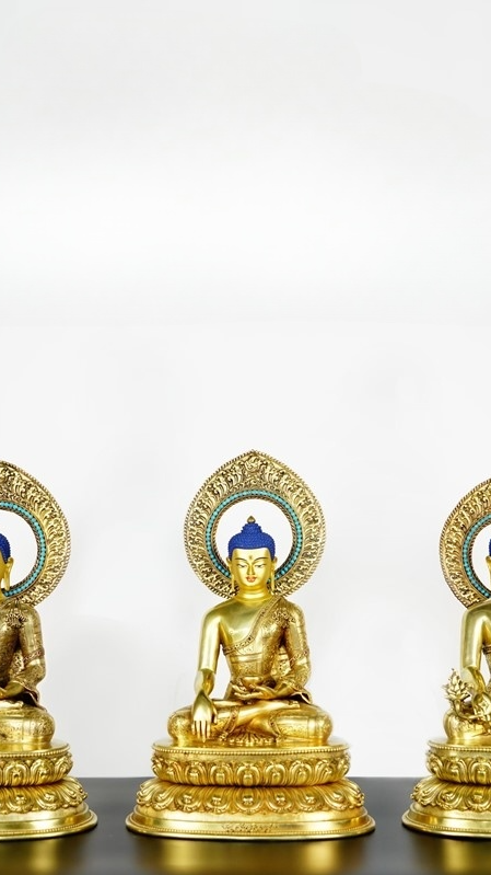 Alt text: Elegant Tibetan Buddhist Three Worlds Buddha Statue, handcrafted with rich mineral paints and gold-plated details, ideal for home decor and meditation.